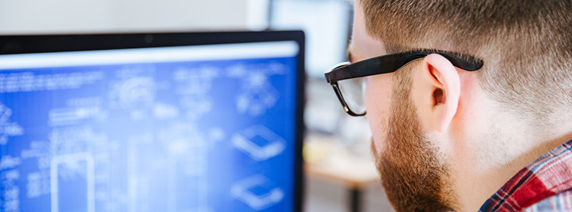 Man in front of computer screen