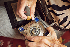 Hands with ring and medal