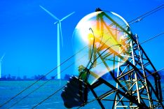 Light bulb in front of wind turbine