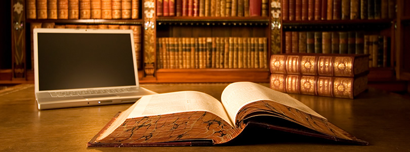 Library with old books and a computer