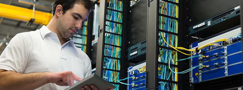 Technician at work in a server room