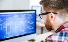 Man in front of a computer screen