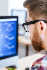 Man in front of a computer screen